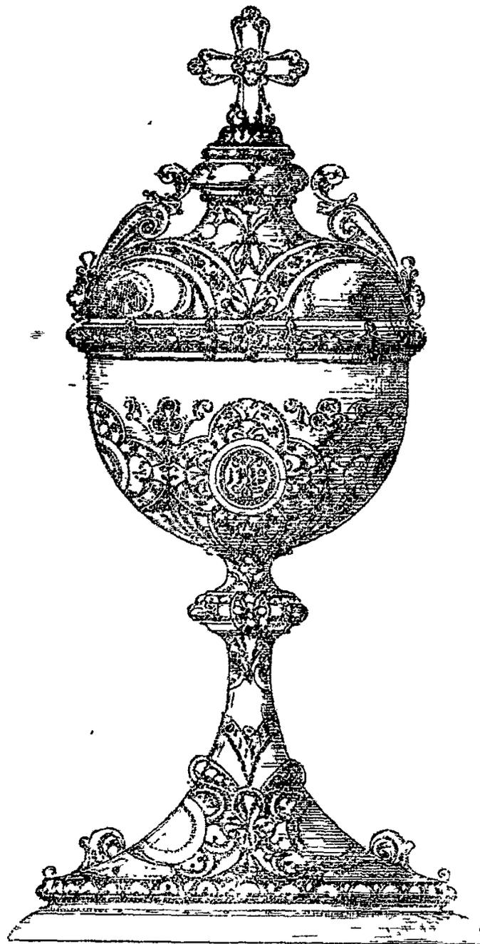 A detailed black and white illustration of a highly ornate chalice. The bowl is decorated with a central medallion and floral patterns. The stem is slender and features decorative elements. The lid is domed and topped with a cross, with small figures on the shoulders. The base is wide and decorated with scrollwork.